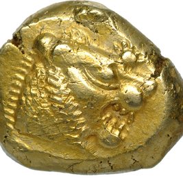 ungleichmäßig geformte Münze, darauf ein Tierkopf