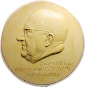 Rudolf Mauersberger Medaille, darauf seitliches Portrait eines Mannes mit Glatze und Brille