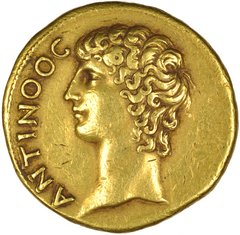 Goldmünze mit Kopf