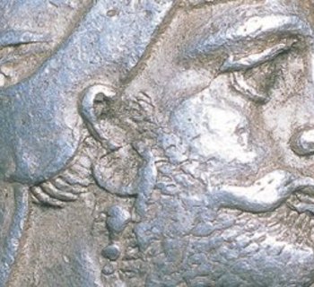 persische Münze mit einem Männerkopf